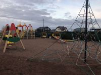 Детская игровая площадка с лазалкой у детского клуба в коттеджном поселке Малиновые вечера
